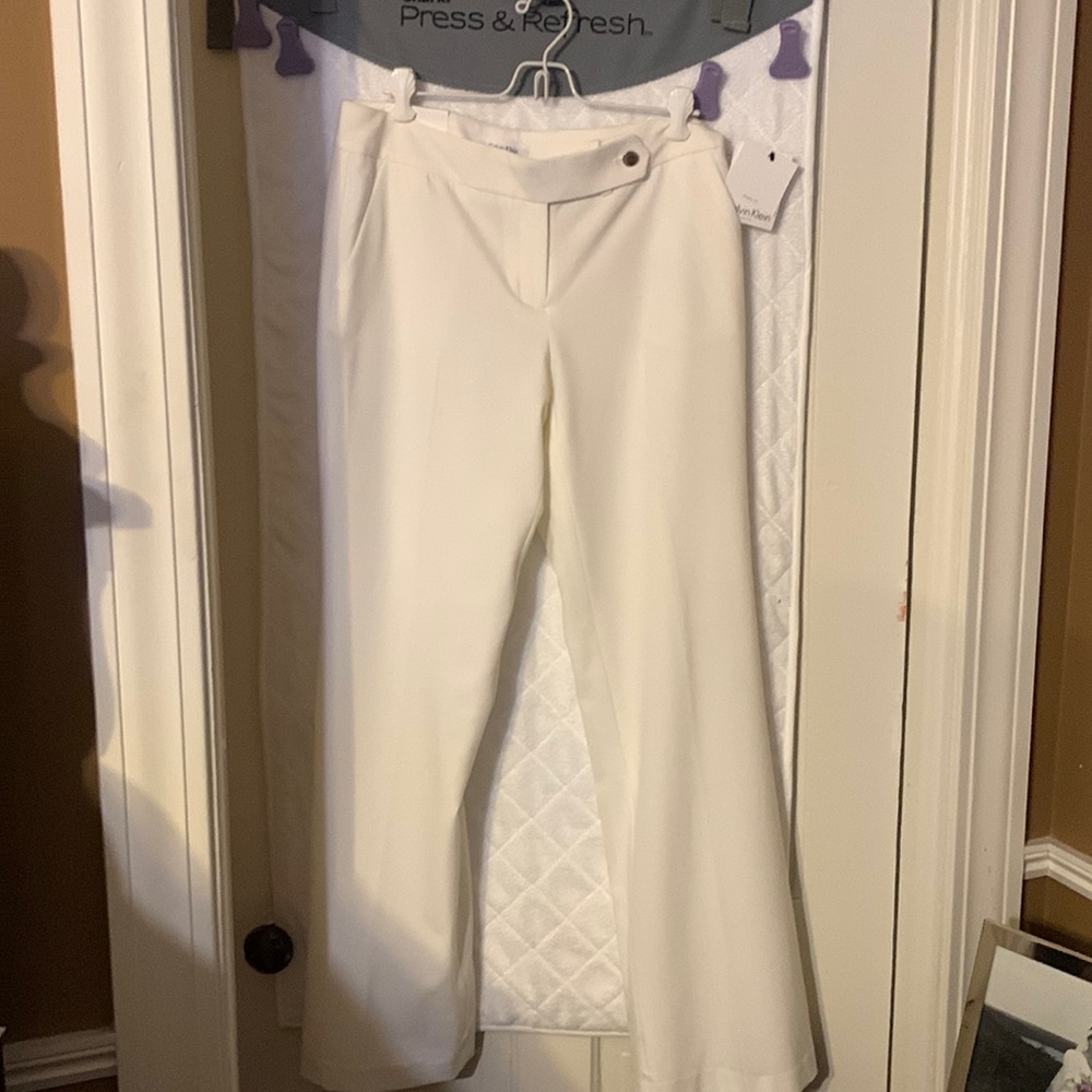Calvin Klein cream classic fit size 4 pants, front and back pockets.